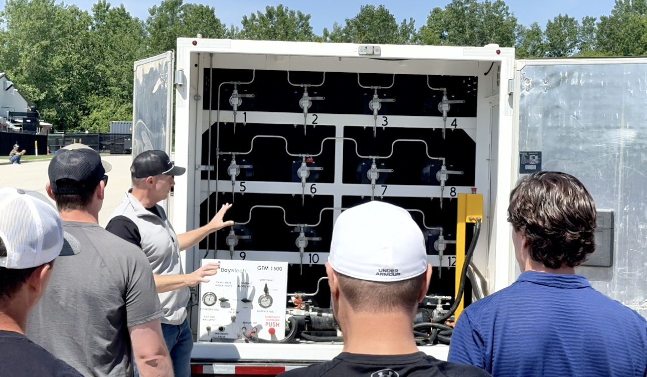 Inside the NitroTech nitrogen trailer — field crew walkthrough with the equipment panel and 16 high-pressure storage tubes inside